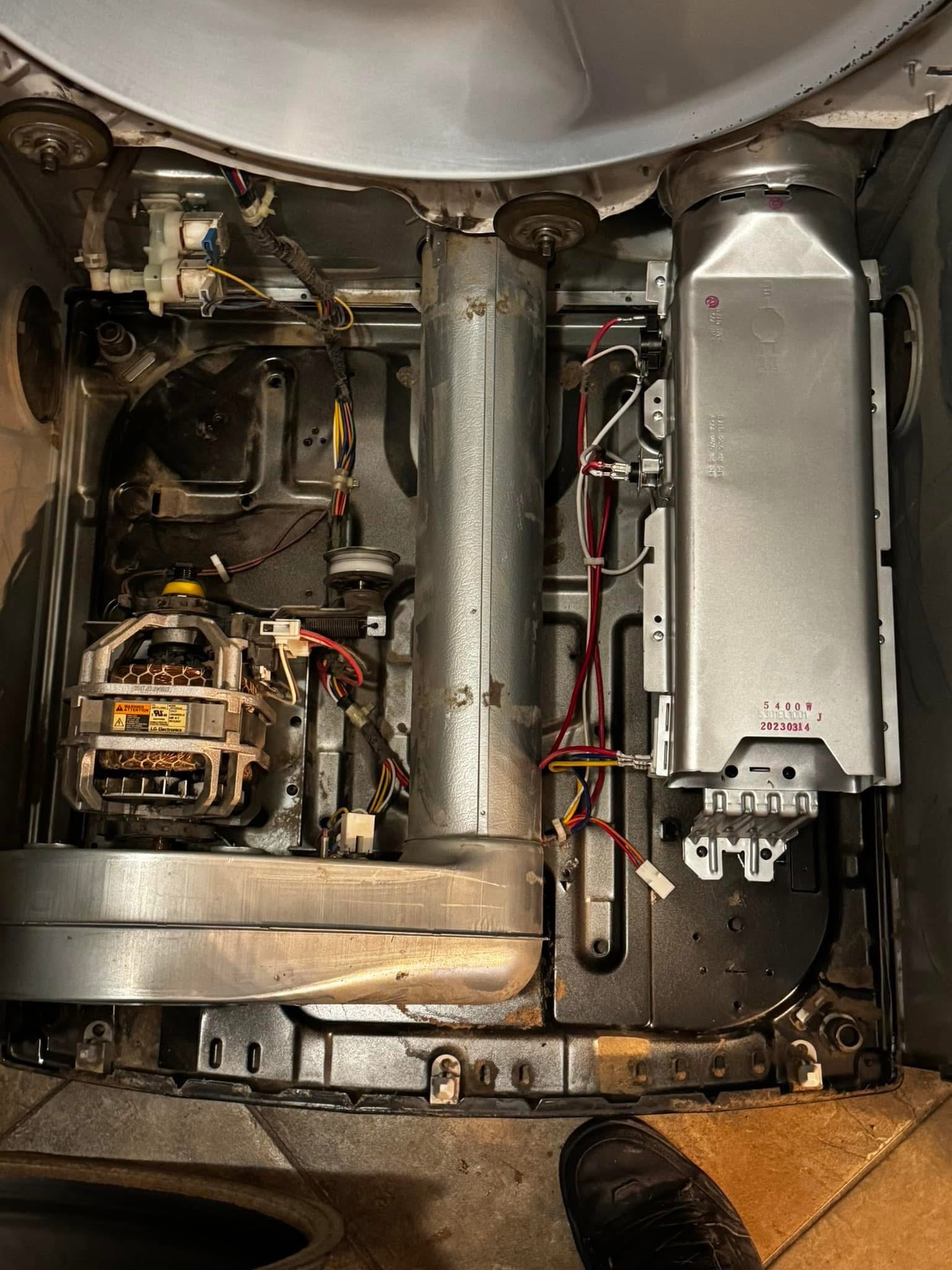 The same dryer interior after lint and debris were removed